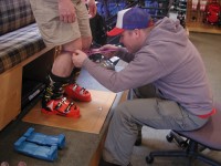 Here's a boot fitting pro doing a stance analysis.  
Credit: Steve Cohen