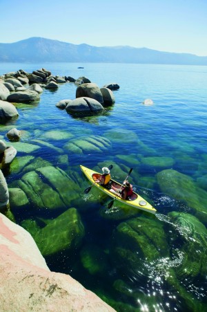 Kayaking is a great upper-body workout for skiers in the off-season and especially relaxing on the calm waters of Lake Tahoe, one of the clearest lakes in the world with water clarity of more than 70 feet. Credit: The Ritz-Carlton, Lake Tahoe
