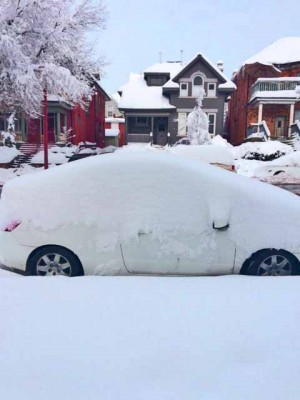 Snow-covered Prius shows depth from one-day storm in SLC.