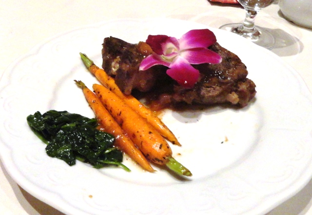 Organic spinach, carrots and lamb topped with a wildflower. Credit: Harriet Wallis