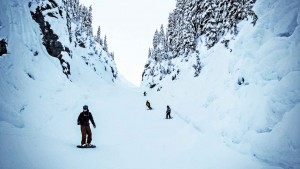 The Canyon, one of Mt. Baker's signature runs, takes skiers and boarders into a narrow drop between mountain walls. Credit: John Nelson