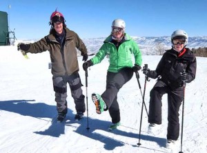 Correspondent Harriet Wallis bribed son Cal, daughter Alison, and best ski buddy Laurie to demonstrate warm ups at the top of a Deer Valley lift. Credit: Harriet Wallis