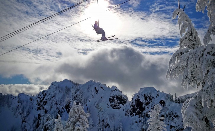A skier rides the upper-elevation Edelweiss Chair at Alpental. Credit: John Nelson