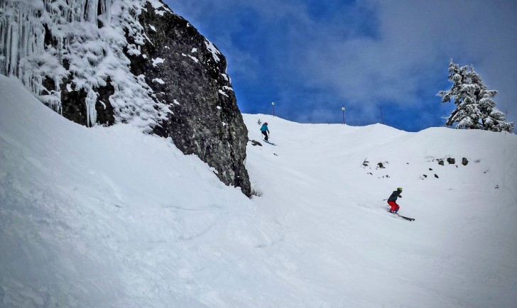 Skiers negotiate the cliff area of Rollen on the Edelweiss Chair at Alpental. Credit: John Nelson