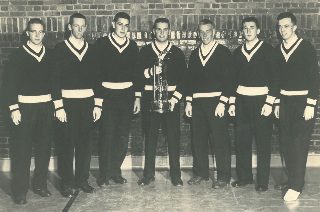 Bowdoin College ski team circa 1958 with state championship trophy. John Christie is third from right. He was originally a reluctant competitor. Credit: John Christie
