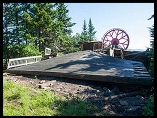 Spruce Peak's bull wheel was pulled downhill by the weight of the cable and chairs after the foundation gave way. Credit: WCSH